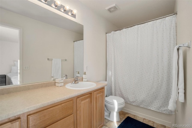 bathroom with toilet, vanity, tile patterned flooring, and curtained shower