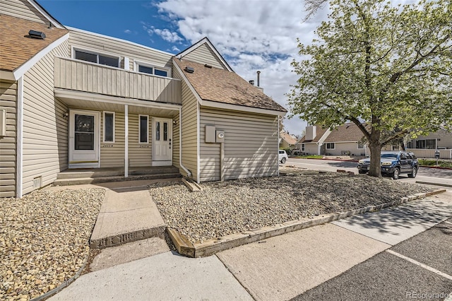 2469 S Xanadu Way Unit A, Aurora, CO 80014 - view of front facade with a balcony and covered porch