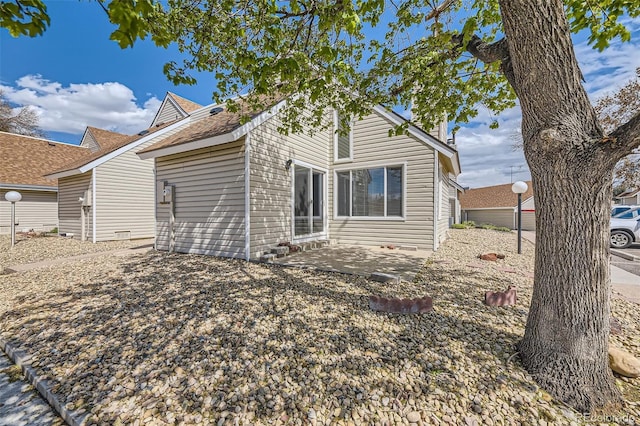 2469 S Xanadu Way Unit A, Aurora, CO 80014 - view of property exterior featuring a patio