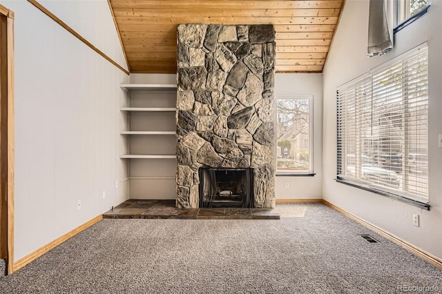 2469 S Xanadu Way Unit A, Aurora, CO 80014 - unfurnished living room with wooden ceiling, lofted ceiling, carpet flooring, a fireplace, and baseboards