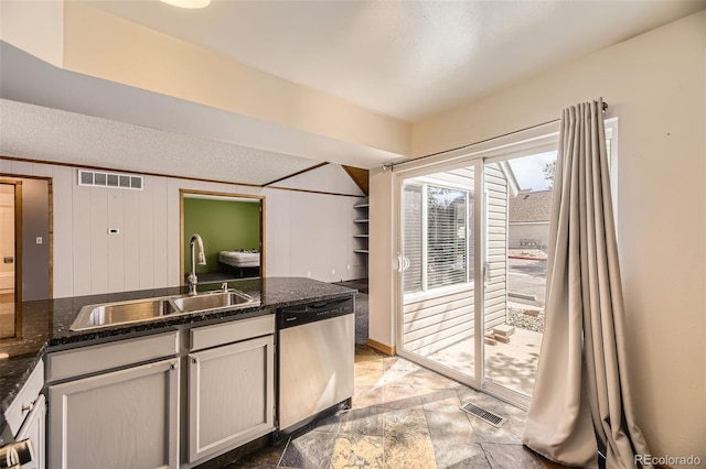 2469 S Xanadu Way Unit A, Aurora, CO 80014 - kitchen featuring dishwasher, a sink, dark stone counters, and a textured ceiling