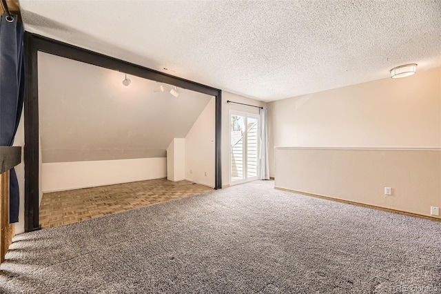 2469 S Xanadu Way Unit A, Aurora, CO 80014 - bonus room with a textured ceiling, carpet, and vaulted ceiling