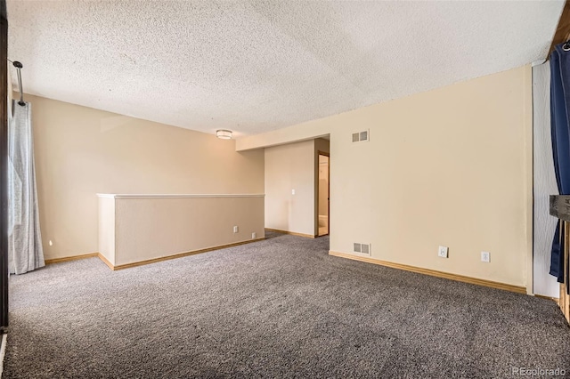 2469 S Xanadu Way Unit A, Aurora, CO 80014 - spare room with carpet, a textured ceiling, and baseboards