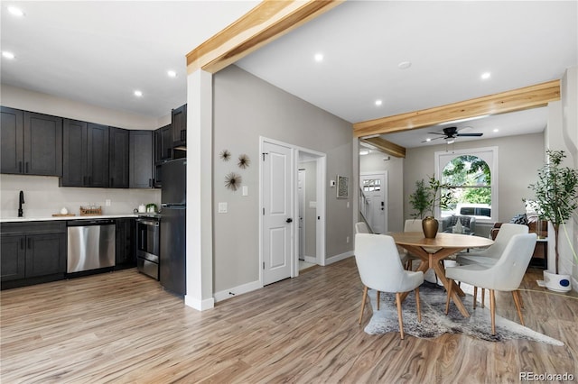 dining room featuring ceiling fan, sink, beam ceiling, and light hardwood / wood-style flooring