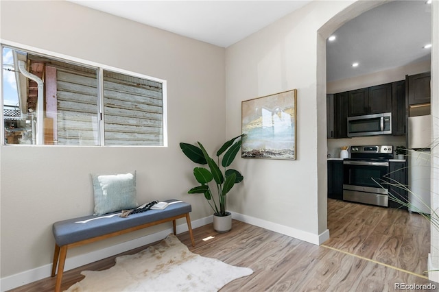 living area with light hardwood / wood-style flooring