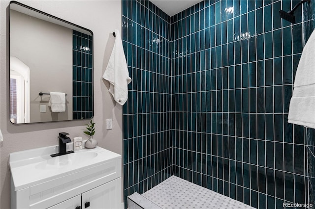 bathroom featuring vanity and a shower