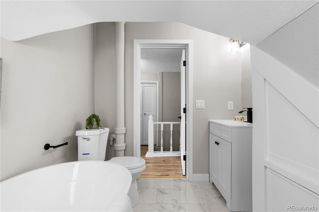 bathroom featuring a tub to relax in and vanity