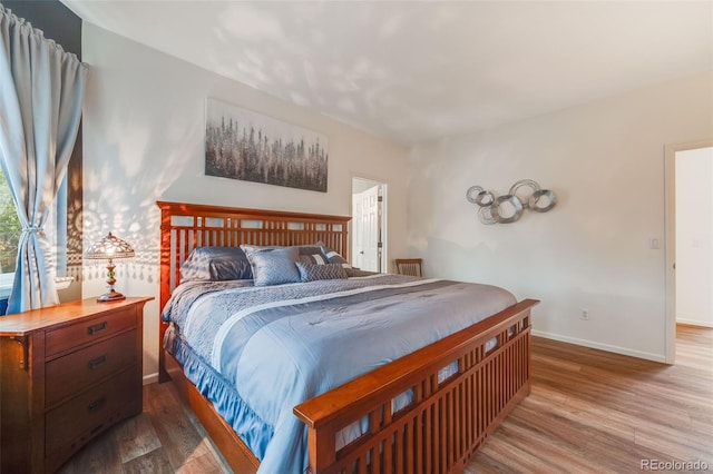 236 E Fair Ln, Centennial, CO 80121 - bedroom featuring wood finished floors and baseboards