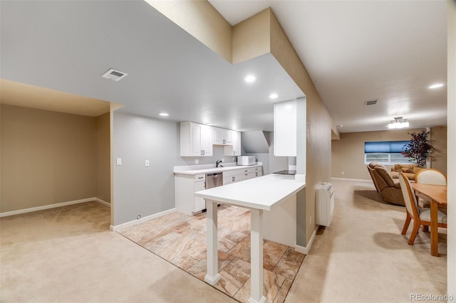 236 E Fair Ln, Centennial, CO 80121 - kitchen with light carpet, open floor plan, light countertops, baseboards, and recessed lighting