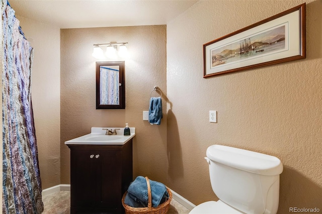 236 E Fair Ln, Centennial, CO 80121 - bathroom featuring vanity, toilet, and a shower with curtain