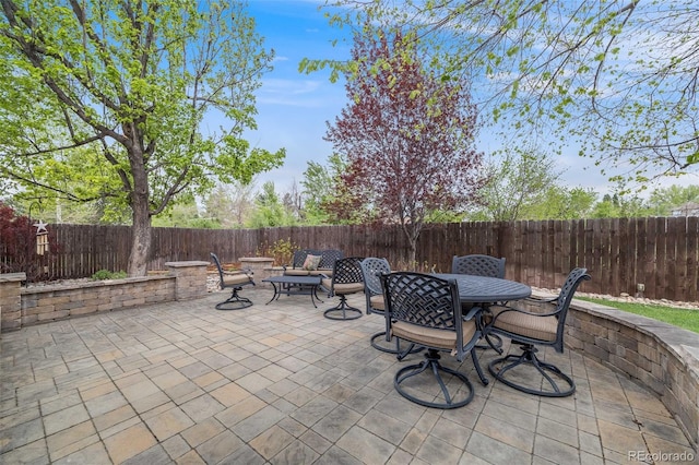 236 E Fair Ln, Centennial, CO 80121 - view of patio featuring a fenced backyard and outdoor dining space