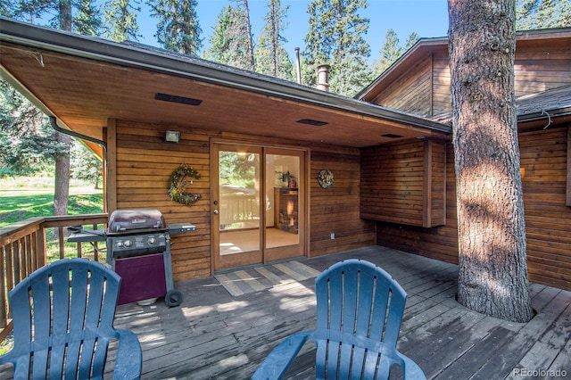 wooden terrace featuring area for grilling