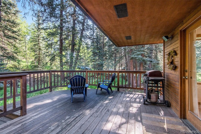 wooden deck with area for grilling