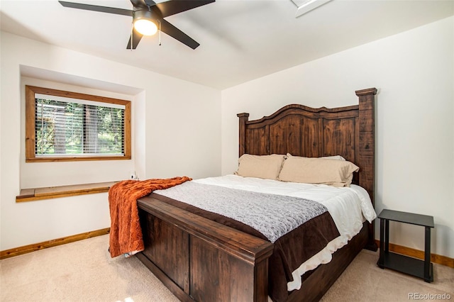 bedroom featuring ceiling fan and light colored carpet