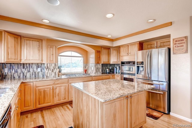 20341 E 48th Pl, Denver, CO 80249 - kitchen featuring stainless steel appliances, light wood-style flooring, light stone countertops, a center island, and recessed lighting