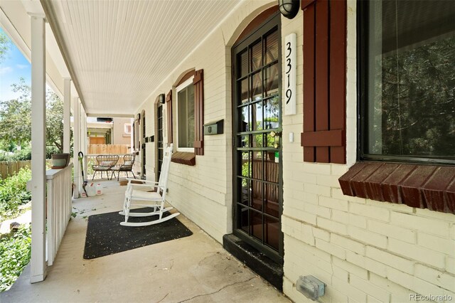3319 Newton St, Denver, CO 80211 - view of exterior entry featuring a porch