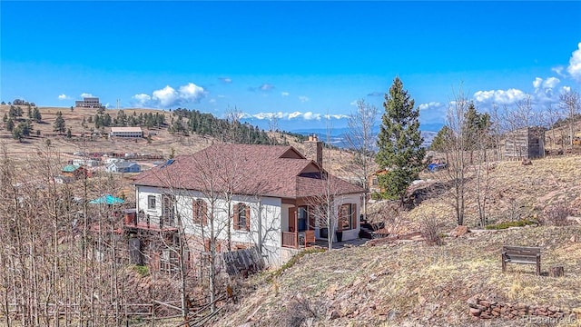 224 W Warren Ave, Cripple Creek, CO 80813 - view of front of house with a chimney