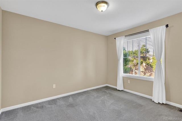 8489 S Quay St, Littleton, CO 80128 - carpeted spare room featuring baseboards