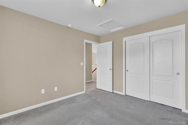 8489 S Quay St, Littleton, CO 80128 - unfurnished bedroom featuring attic access, carpet, and a closet