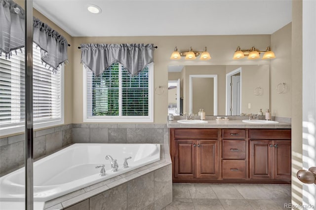 8489 S Quay St, Littleton, CO 80128 - bathroom featuring double vanity, a garden tub, and tile patterned flooring