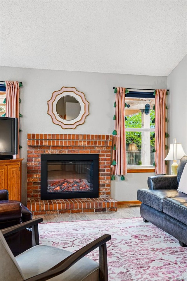 13313 Cherry Cir, Thornton, CO 80241 - living room featuring a textured ceiling and a fireplace