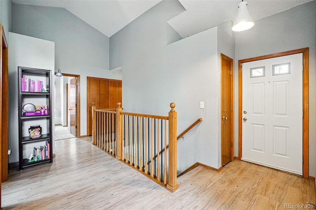 13313 Cherry Cir, Thornton, CO 80241 - foyer featuring wood finished floors, baseboards, and high vaulted ceiling