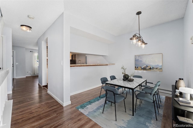 6011 Yarrow St Unit I, Arvada, CO 80004 - dining room featuring wood finished floors and a textured ceiling