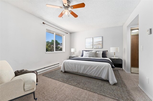 6011 Yarrow St Unit I, Arvada, CO 80004 - carpeted bedroom featuring a baseboard radiator, a textured ceiling, and ceiling fan