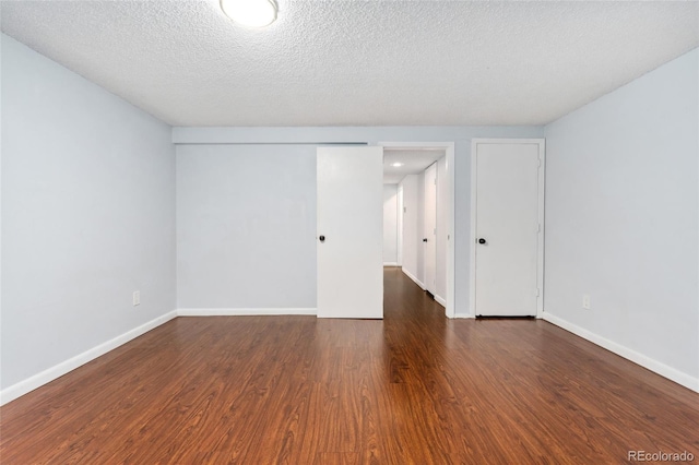 6011 Yarrow St Unit I, Arvada, CO 80004 - unfurnished room featuring wood finished floors and a textured ceiling