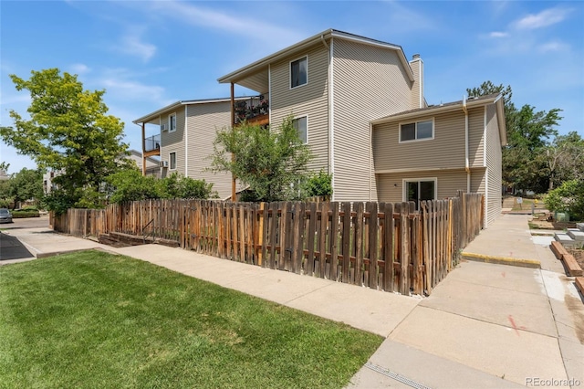 6011 Yarrow St Unit I, Arvada, CO 80004 - view of property exterior with a chimney