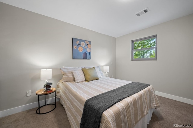 bedroom with carpet and baseboards