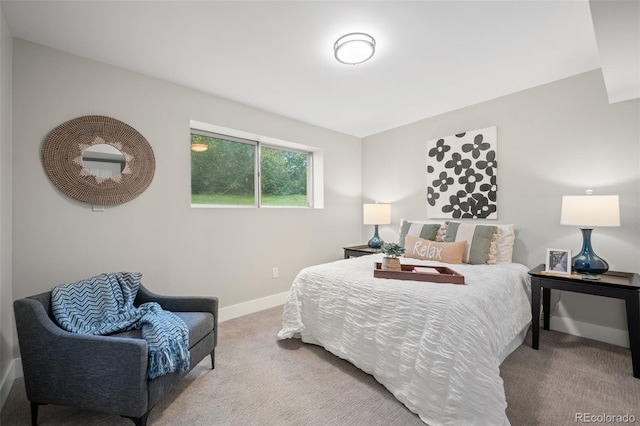 carpeted bedroom featuring baseboards