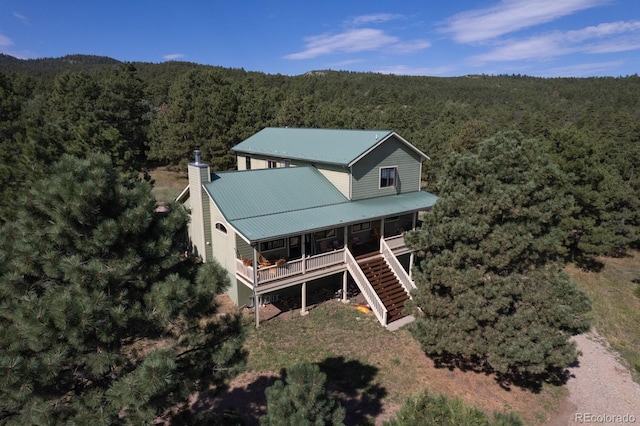 drone / aerial view featuring a view of trees