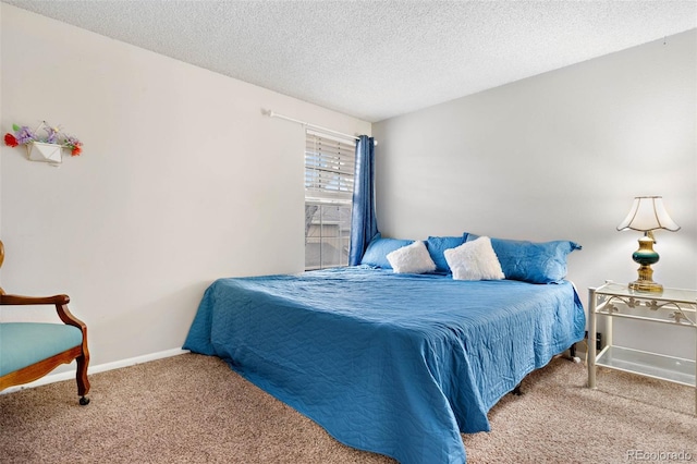 bedroom with carpet and a textured ceiling