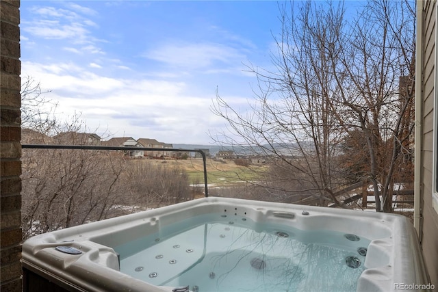 exterior space featuring a hot tub