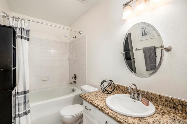 full bath featuring vanity, toilet, and shower / bath combo