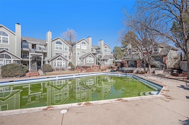 view of pool featuring a residential view