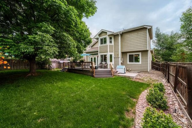 7176 S Pierson St, Littleton, CO 80127 - rear view of house with a wooden deck