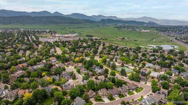 7176 S Pierson St, Littleton, CO 80127 - aerial perspective of suburban area featuring a mountainous background