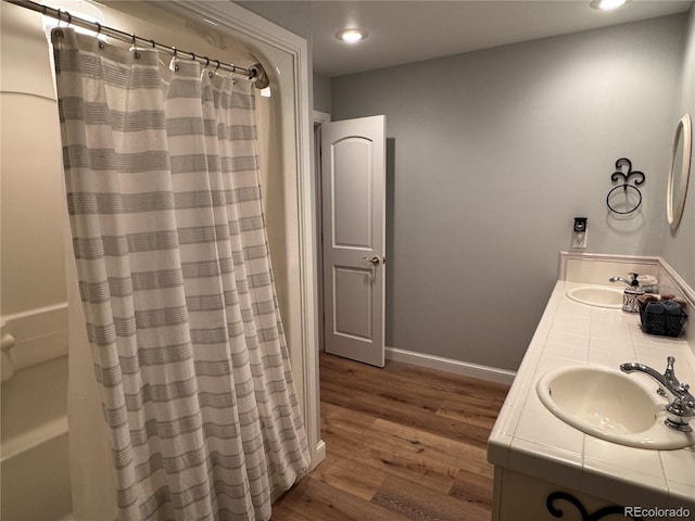 bathroom featuring vanity, curtained shower, and hardwood / wood-style floors