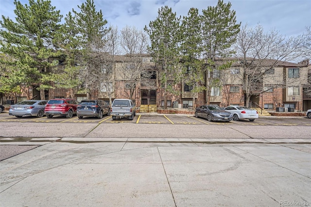 view of property featuring uncovered parking