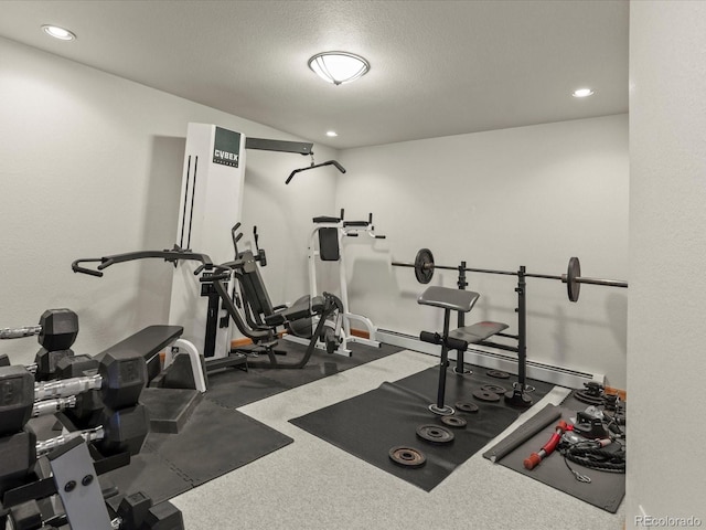 workout room featuring a textured ceiling and recessed lighting