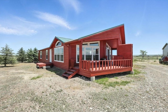 3316 Carlson Rd, Rye, CO 81069 - view of front facade with a wooden deck and a metal roof