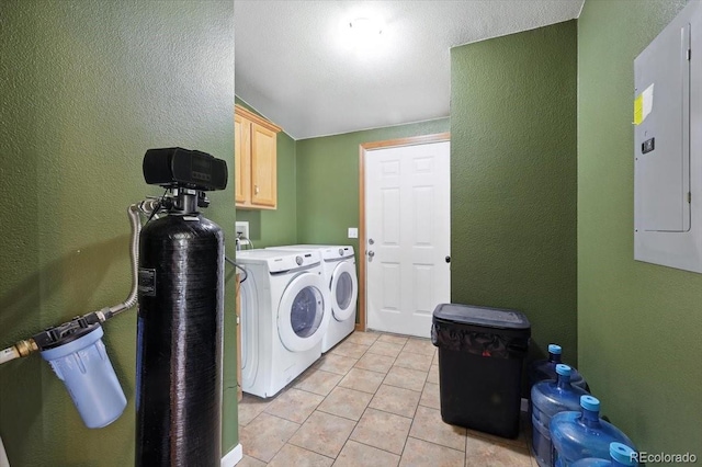 3316 Carlson Rd, Rye, CO 81069 - laundry area featuring cabinet space, washing machine and dryer, a textured wall, light tile patterned floors, and electric panel