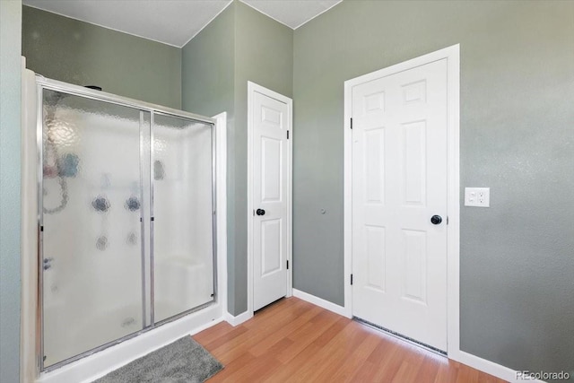 3316 Carlson Rd, Rye, CO 81069 - full bathroom featuring wood finished floors and a shower stall