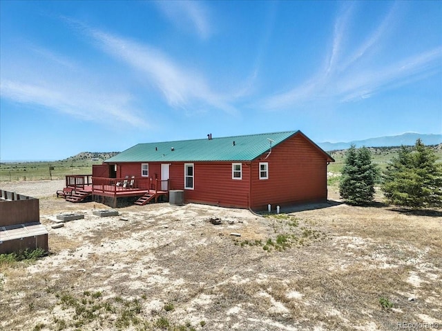 3316 Carlson Rd, Rye, CO 81069 - back of house with a deck with mountain view and a metal roof