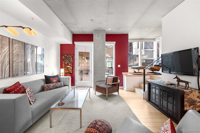 living room with light hardwood / wood-style flooring