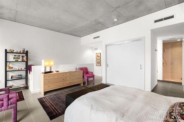 tiled bedroom with a closet