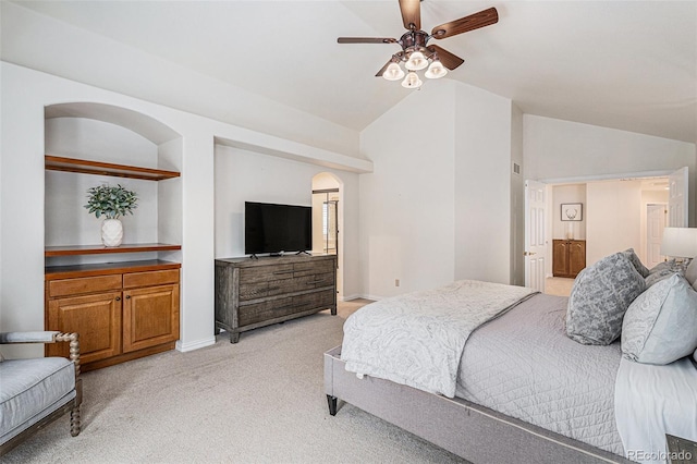 bedroom featuring light colored carpet, baseboards, ceiling fan, and vaulted ceiling