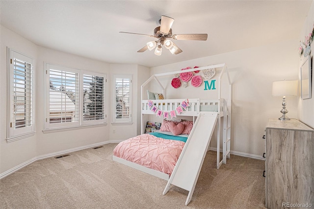 bedroom with visible vents, carpet flooring, and baseboards